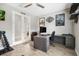 A bedroom featuring motorcycle decor, a large desk, and a view to another room at 14514 Woodland Spur Dr, Lithia, FL 33547