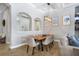 Cozy dining room with stylish light fixture, comfortable seating, and elegant decor for Gathering meals at 14514 Woodland Spur Dr, Lithia, FL 33547