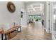 Inviting entryway with tile floors leading to an open living space and a view of the backyard pool at 14514 Woodland Spur Dr, Lithia, FL 33547