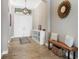 Bright entryway with wood-look tile flooring and elegant decor at 14514 Woodland Spur Dr, Lithia, FL 33547