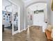 Spacious entryway with an arched doorway and a view into the home gym at 14514 Woodland Spur Dr, Lithia, FL 33547