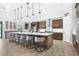 Spacious kitchen with a large center island, pendant lighting, and modern appliances at 14514 Woodland Spur Dr, Lithia, FL 33547