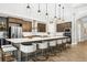 Spacious kitchen featuring a large island with seating and stainless steel appliances at 14514 Woodland Spur Dr, Lithia, FL 33547