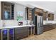 Modern kitchen with stainless steel refrigerator, beverage coolers, and sleek cabinetry at 14514 Woodland Spur Dr, Lithia, FL 33547