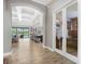 Open-concept living and dining area with sliding glass doors to the outdoor space at 14514 Woodland Spur Dr, Lithia, FL 33547