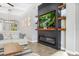 Stylish living room with modern fireplace, built-in shelves, and comfortable seating for relaxation at 14514 Woodland Spur Dr, Lithia, FL 33547