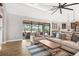 Open living room with large glass doors, blending indoor comfort with the outdoor pool and lake view at 14514 Woodland Spur Dr, Lithia, FL 33547