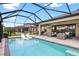 Beautiful screened pool with outdoor seating and a lovely patio, perfect for entertaining at 14514 Woodland Spur Dr, Lithia, FL 33547
