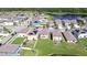 Aerial view of homes and a lake at 15505 Wicked Strong St, Sun City Center, FL 33573