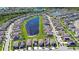 Extensive aerial view of a residential community surrounding a central lake at 15505 Wicked Strong St, Sun City Center, FL 33573