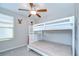 Bedroom featuring a bunk bed, ceiling fan, and window for plenty of natural light at 15505 Wicked Strong St, Sun City Center, FL 33573