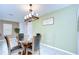 Inviting dining room with a glass-top table and stylish chandelier at 15505 Wicked Strong St, Sun City Center, FL 33573