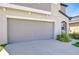 Spacious two-car garage featuring an automatic door and convenient driveway access at 15505 Wicked Strong St, Sun City Center, FL 33573