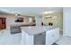 Open concept kitchen, dining, and living area featuring stainless appliances and granite countertops at 15505 Wicked Strong St, Sun City Center, FL 33573