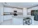 Bright kitchen features white cabinetry, granite countertops, and stainless steel appliances at 15505 Wicked Strong St, Sun City Center, FL 33573
