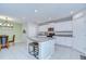 Modern kitchen featuring granite counters, stainless appliances, and an island with seating at 15505 Wicked Strong St, Sun City Center, FL 33573