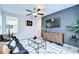 Inviting living room with modern decor, TV, and ceiling fan at 15505 Wicked Strong St, Sun City Center, FL 33573