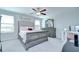 Spacious main bedroom with large windows, a decorative mirror, and ample natural light at 15505 Wicked Strong St, Sun City Center, FL 33573