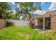 Large backyard featuring a lawn, landscaping, and a privacy fence at 1621 Crossridge Dr, Brandon, FL 33510