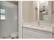 Updated bathroom featuring modern vanity, fixtures, and a shower behind glass doors at 1621 Crossridge Dr, Brandon, FL 33510