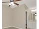Bedroom featuring new floors, neutral walls, ceiling fan, and attached bathroom at 1621 Crossridge Dr, Brandon, FL 33510