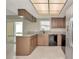 Kitchen with neutral countertops, tile flooring and a stainless steel refrigerator at 1621 Crossridge Dr, Brandon, FL 33510