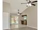 Open living room with sliding doors, ceiling fans, and convenient bar seating at 1621 Crossridge Dr, Brandon, FL 33510