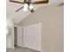 Spacious main bedroom with ceiling fan and view of the ensuite bathroom with modern vanity at 1621 Crossridge Dr, Brandon, FL 33510