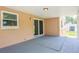 Spacious covered patio with concrete flooring, offers an ideal spot for outdoor lounging and entertainment at 1621 Crossridge Dr, Brandon, FL 33510