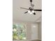 Bright room featuring windows, a ceiling fan, a gray wall paint and a white entry door at 1621 Crossridge Dr, Brandon, FL 33510