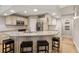 Stylish kitchen with granite countertops, stainless steel appliances, and a breakfast bar with seating at 17311 Carriage Way, Odessa, FL 33556