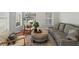 Cozy living room with modern furniture, soft rug, and natural light at 17311 Carriage Way, Odessa, FL 33556