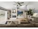 Bright, open living room featuring a fireplace and sliding glass doors leading to a pool at 17311 Carriage Way, Odessa, FL 33556