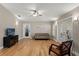 Inviting living room with hardwood floors, natural lighting, and access to the outdoor patio at 17311 Carriage Way, Odessa, FL 33556