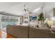 Bright living room with fireplace, vaulted ceilings, and pool view at 17311 Carriage Way, Odessa, FL 33556