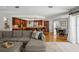Open-concept living area featuring tile floors, a modern kitchen, and comfortable seating at 17311 Carriage Way, Odessa, FL 33556