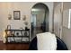 Stylish entryway featuring hardwood floors, decorative shelves, and an arched doorway at 1941 Greenwood Valley Dr, Plant City, FL 33563