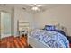 Bedroom features a white wood frame, matching desk and beautiful blue patterned bedding at 2535 Regal River Rd, Valrico, FL 33596