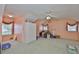 Spacious bonus room with carpeted floors, natural light, and versatile storage options at 2535 Regal River Rd, Valrico, FL 33596