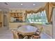 Eat-in kitchen with a large window offering views of the landscaped backyard at 2535 Regal River Rd, Valrico, FL 33596