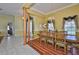 Well-lit dining area showcasing hardwood floors, elegant lighting, and open access to other rooms at 2535 Regal River Rd, Valrico, FL 33596