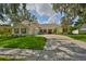 Beautiful single-story home featuring a well-maintained lawn, attached garage, and a classic architecture at 2535 Regal River Rd, Valrico, FL 33596