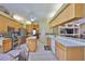 Bright kitchen with stainless appliances, an island, and a view into the adjacent dining area at 2535 Regal River Rd, Valrico, FL 33596