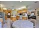 Open-concept kitchen and dining area connected to a living room with a fireplace at 2535 Regal River Rd, Valrico, FL 33596