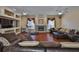 Cozy living room boasts a fireplace, built-in shelving, and comfortable seating at 2535 Regal River Rd, Valrico, FL 33596