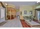 Open-concept living area flows into dining space, featuring tile and hardwood flooring at 2535 Regal River Rd, Valrico, FL 33596