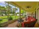 Screened patio featuring ample space, comfortable seating, and a view of the lush backyard at 2535 Regal River Rd, Valrico, FL 33596