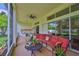 This screened patio includes an outdoor kitchen and comfortable lounge seating, perfect for relaxing and entertaining at 2535 Regal River Rd, Valrico, FL 33596