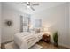 Bright secondary bedroom offers a ceiling fan, closet, and plush carpet floors with neutral paint at 288 Villa Corte Dr, Lutz, FL 33549