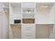Walk-in closet featuring custom shelving and ample storage space at 288 Villa Corte Dr, Lutz, FL 33549